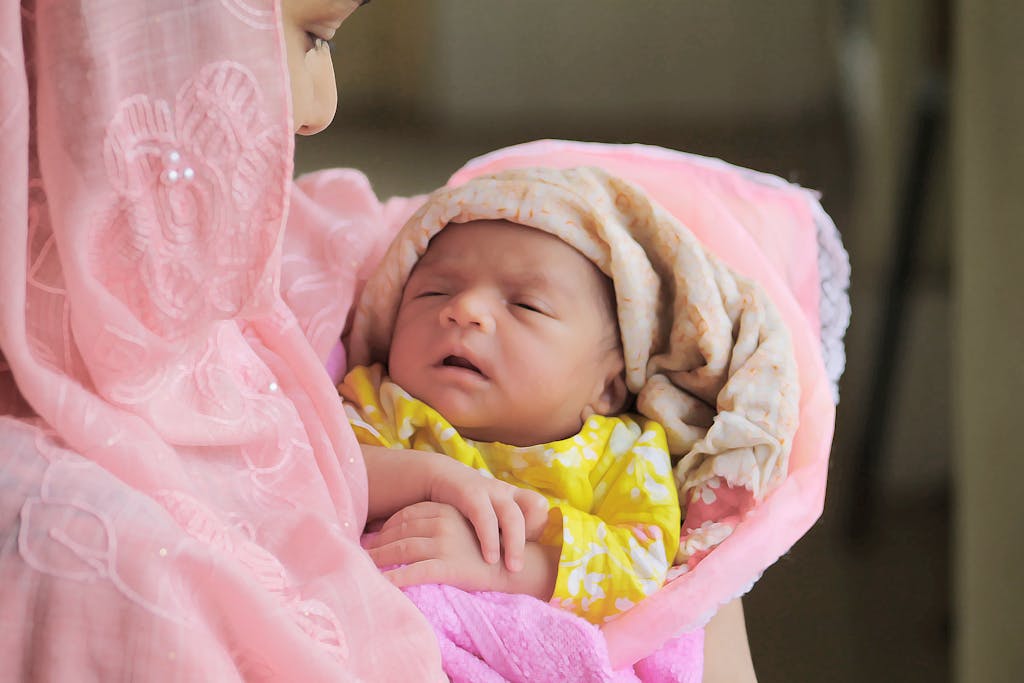 Baby in Pink and White Blanket